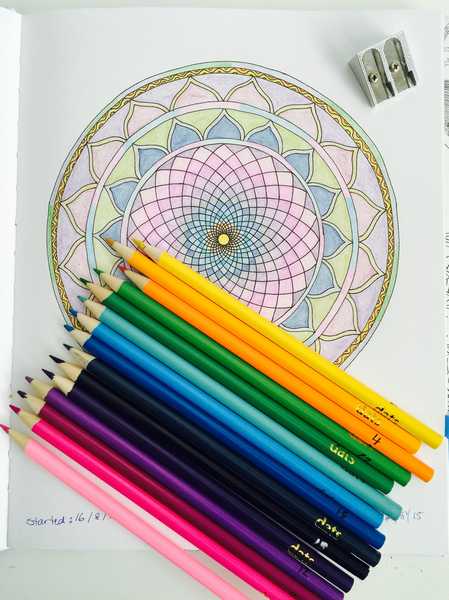 Getting started, these are the Colored pencils, sharpener, and the first picture I colored called the Copper Circle.